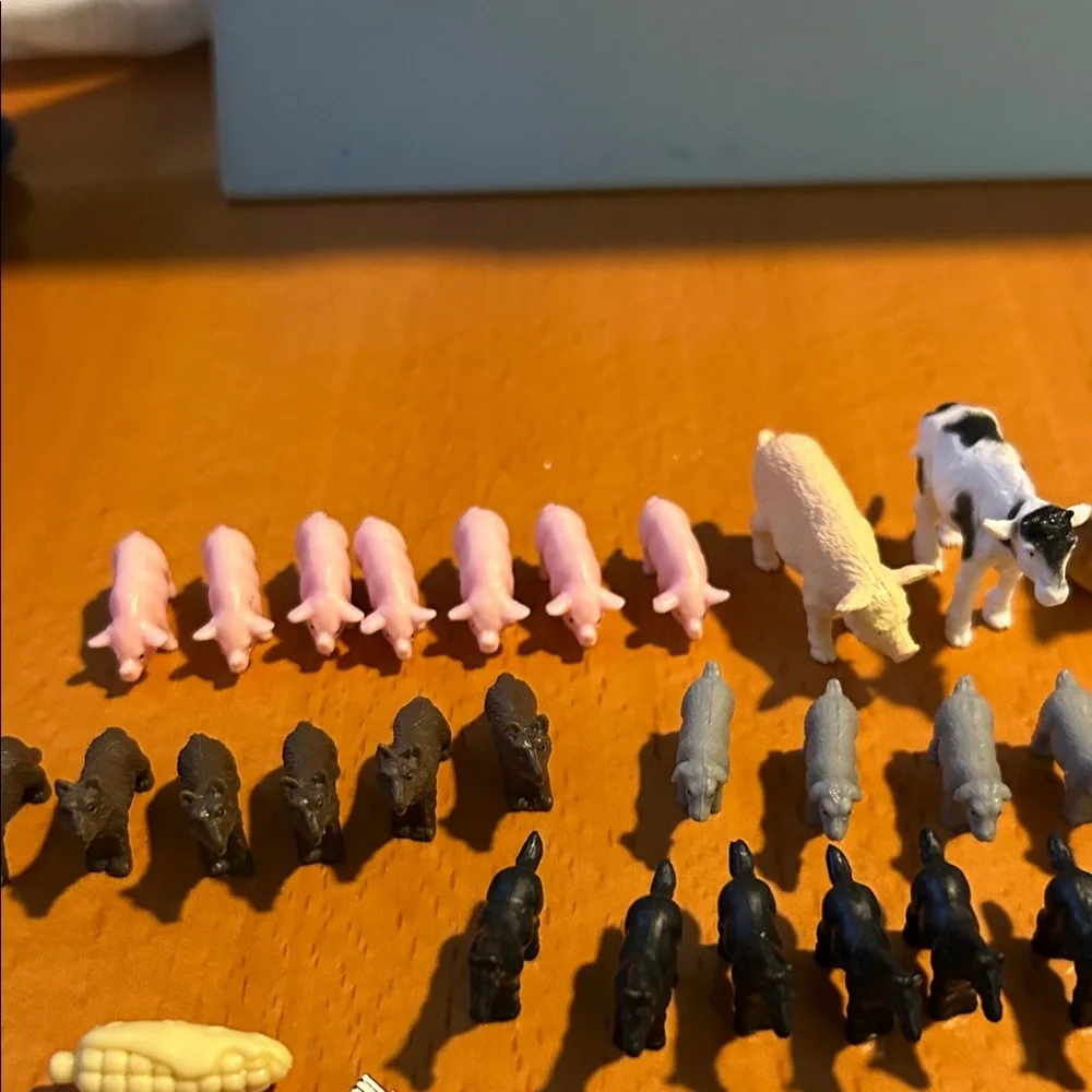 Assorted Used plastic Small Animal Figurine Set in Yellow, Pink, Black, White